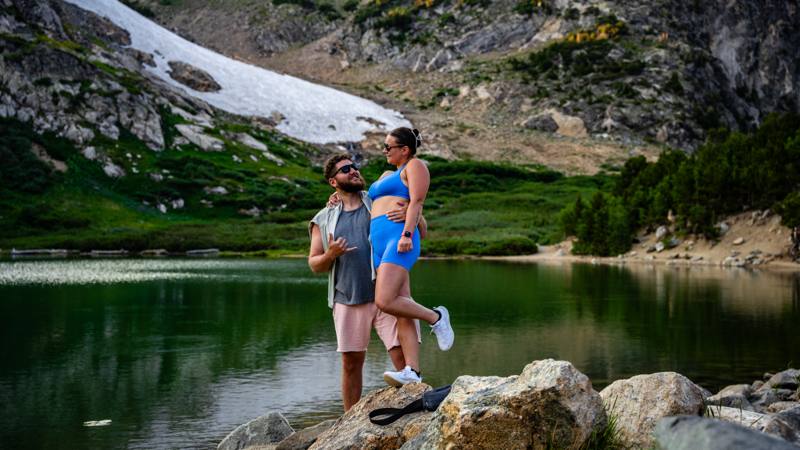 Couples portrait session beside an alpine lake in the Colorado Rockies